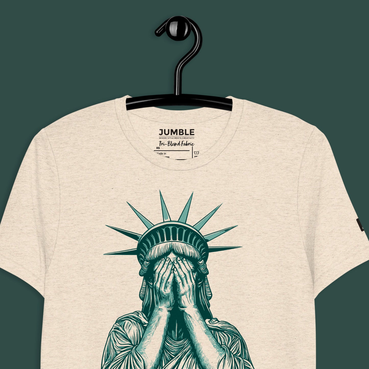 closeup of oatmeal Liberty’s Lament short sleeve vintage t-shirt on a hanger