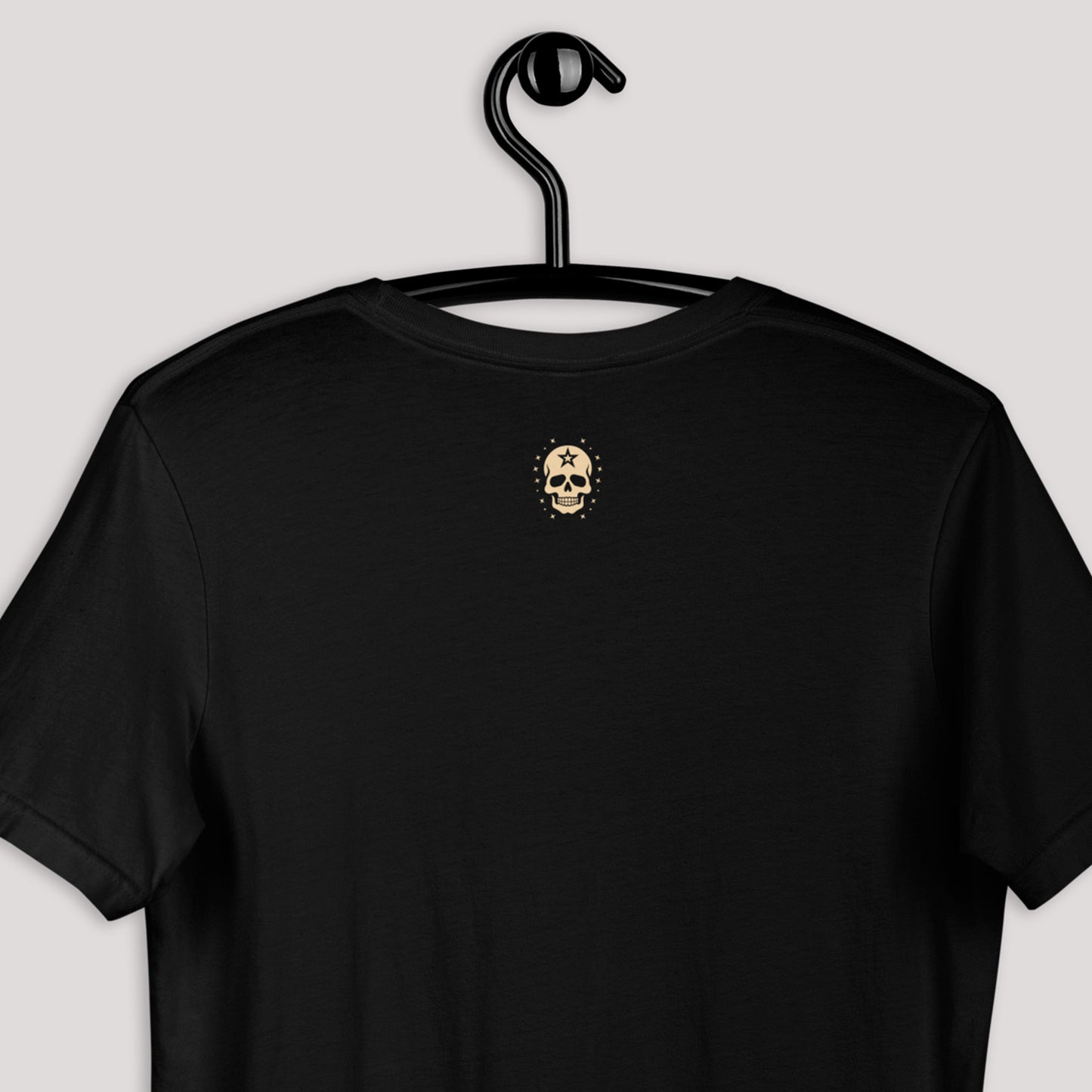 closeup of back view of black Anchor's Tale Unisex t-shirt displayed on a hanger