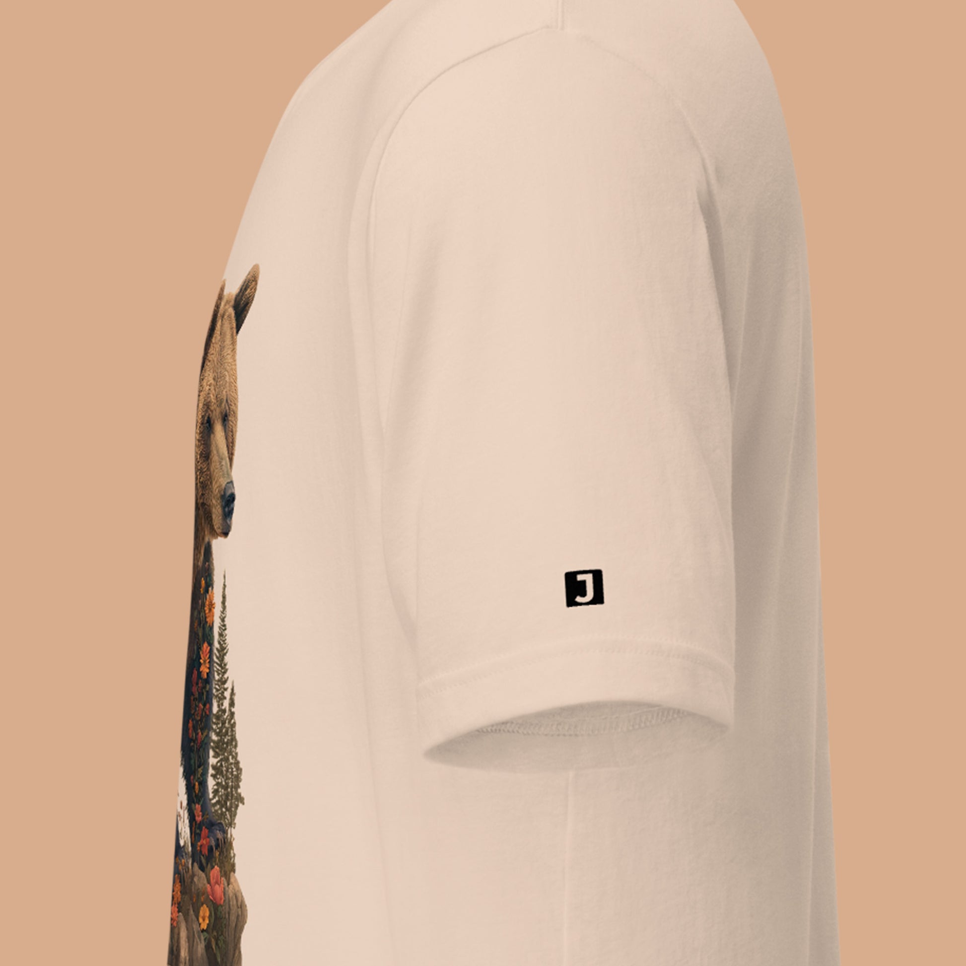 left sleeve logo on a soft cream Wildflowered Bruin Unisex t-shirt