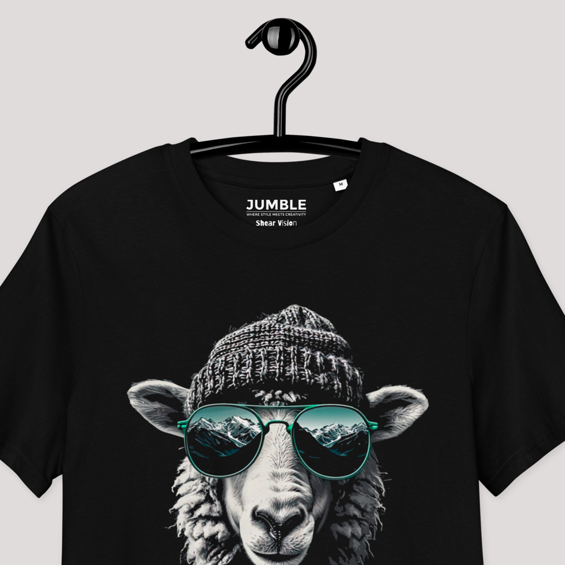 closeup of black Shear vision Premium Unisex organic cotton t-shirt on a hanger