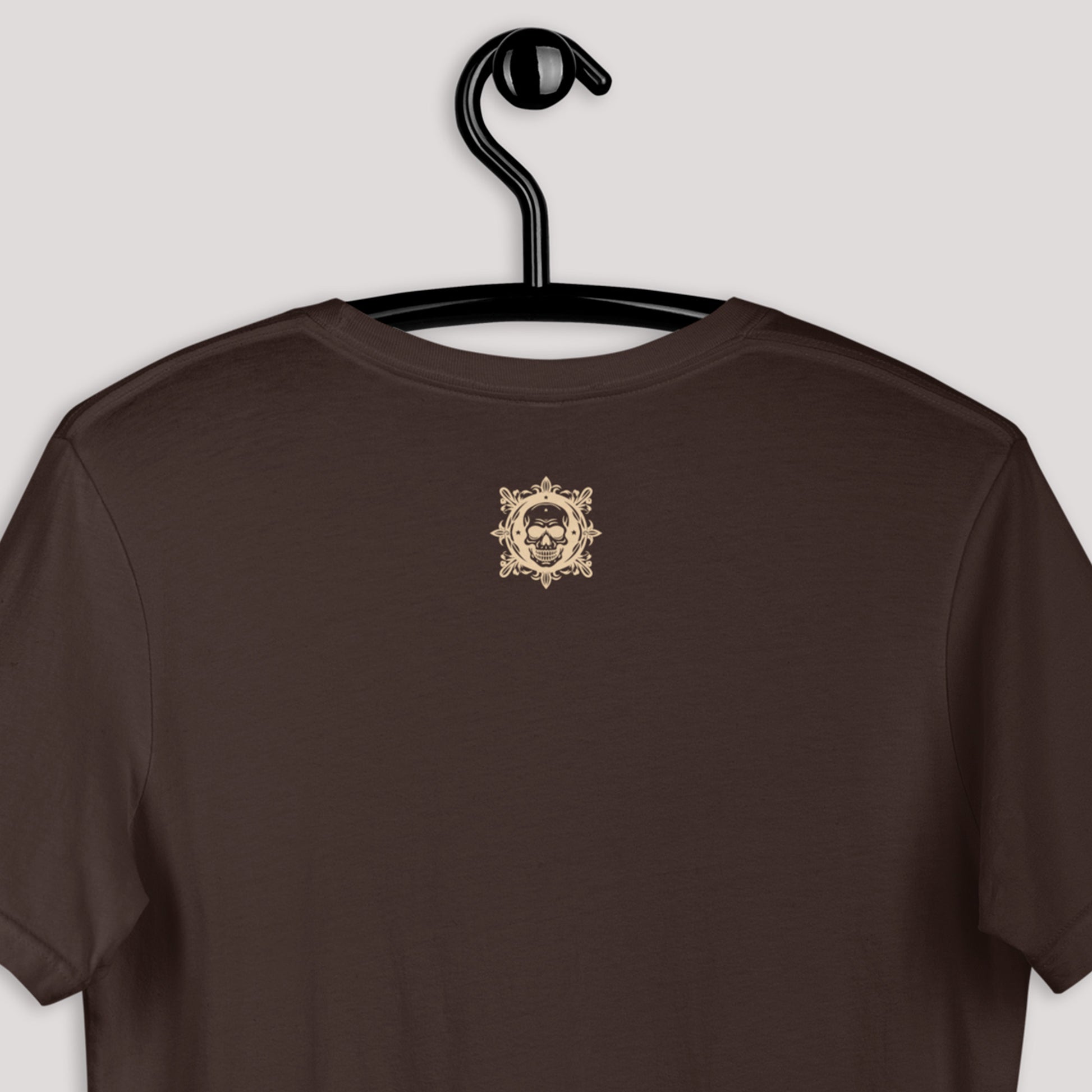 closeup of logo on back of brown Dairy Doll Unisex t-shirt