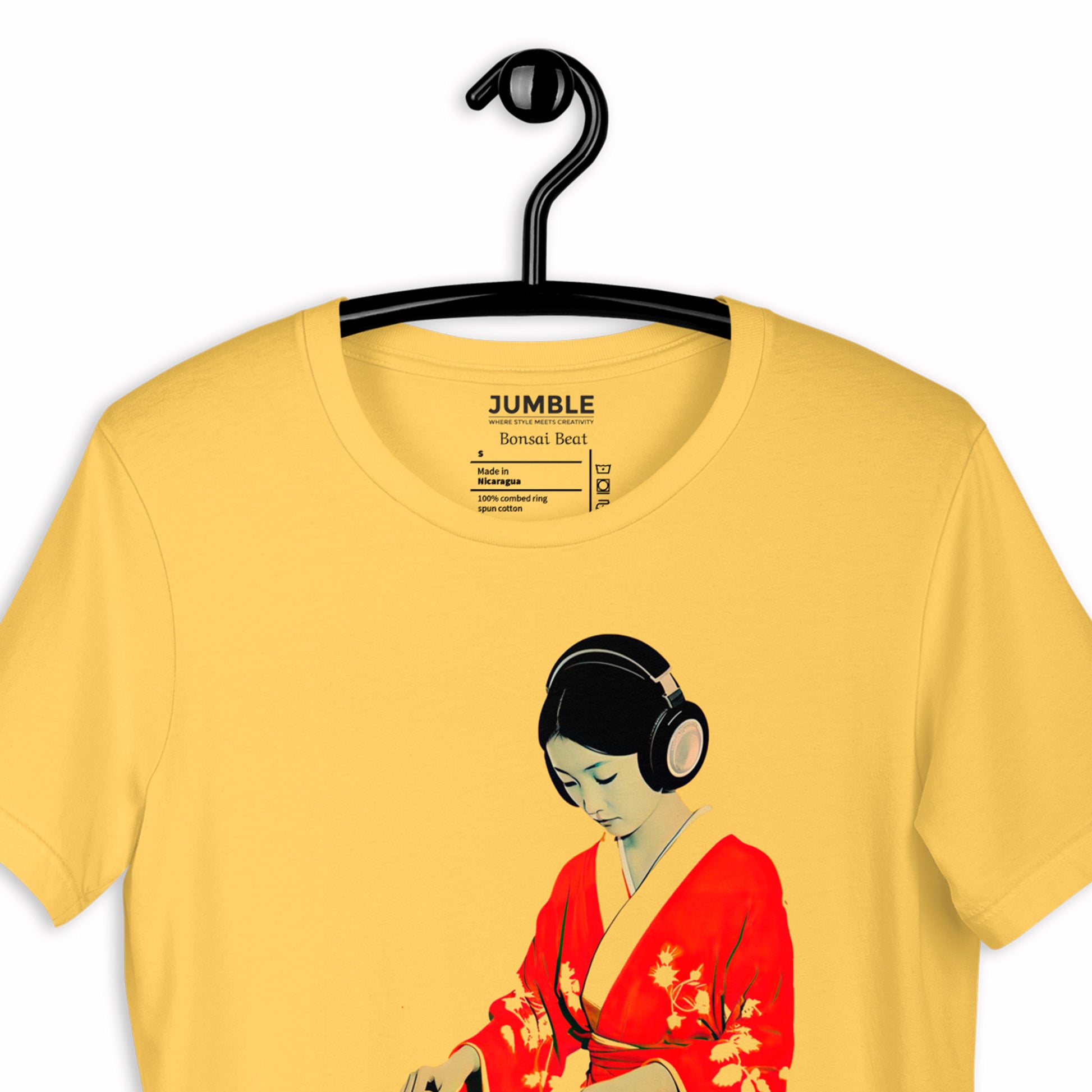 closeup of yellow Bonsai Beat Unisex t-shirt on a hanger