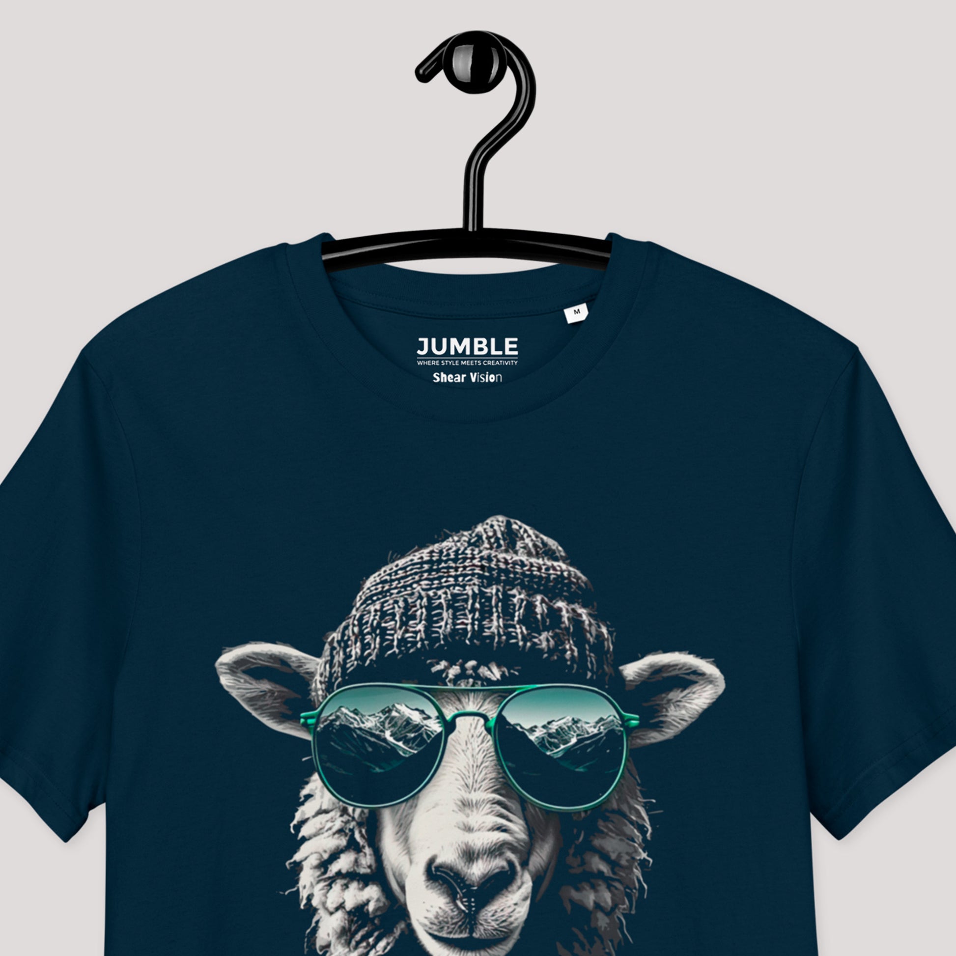 closeup of french navy Shear vision Premium Unisex organic cotton t-shirt on a hanger