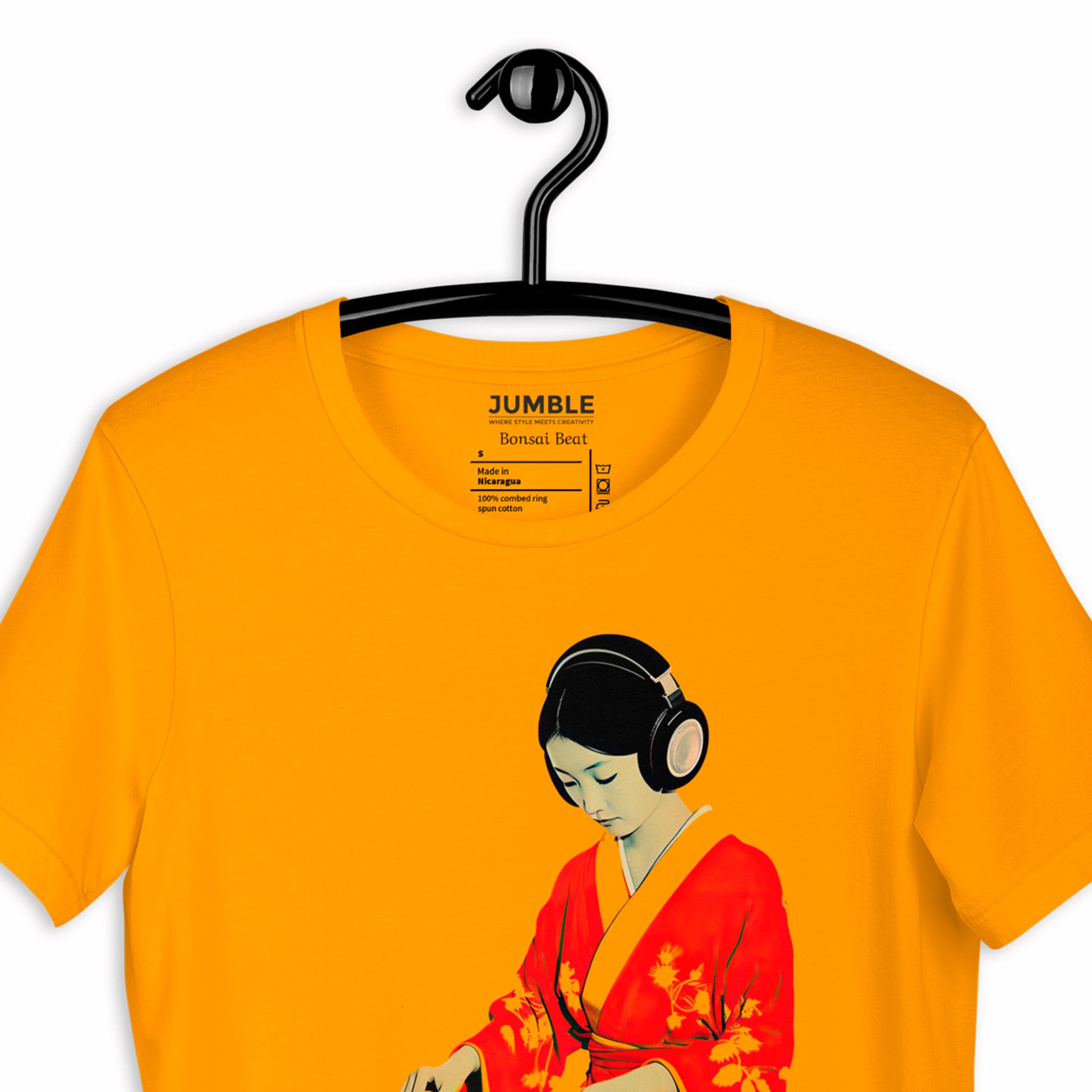 closeup of gold Bonsai Beat Unisex t-shirt on a hanger
