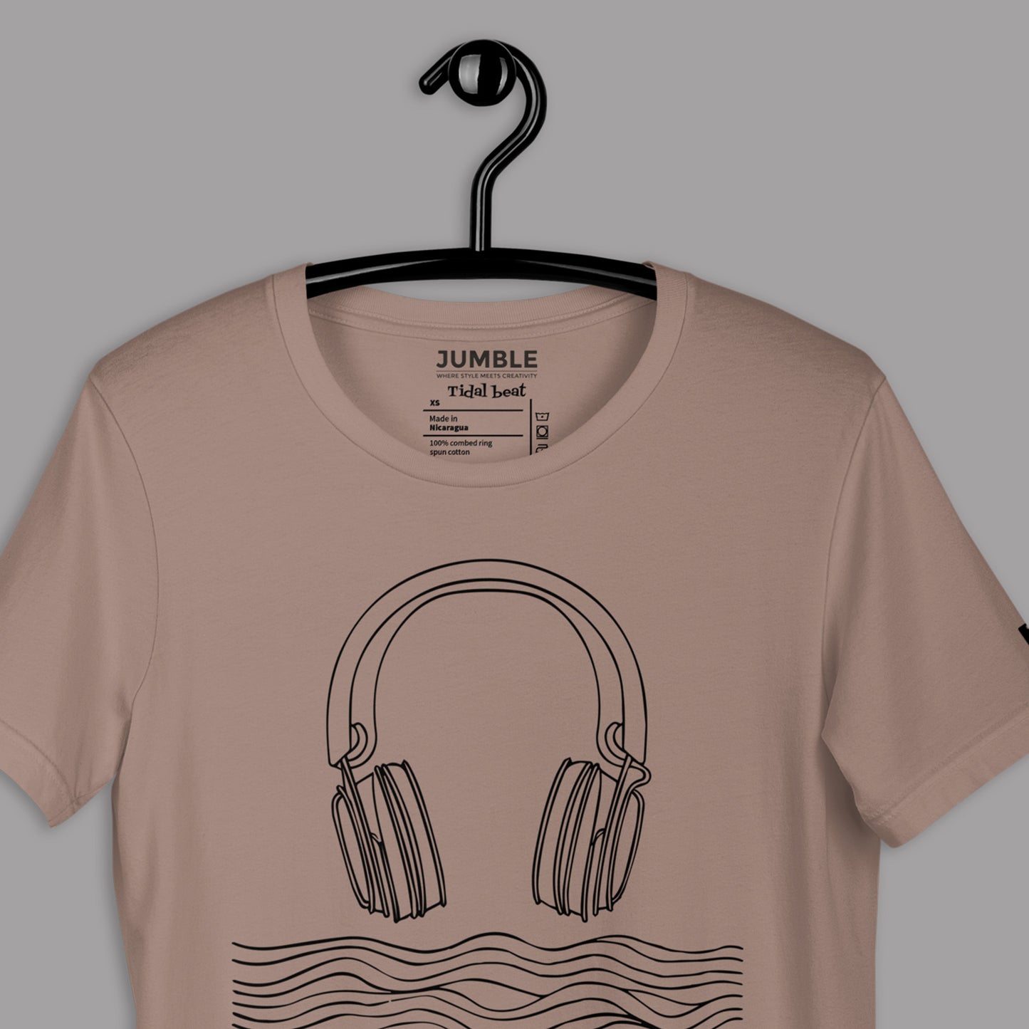 closeup of pebble Tidal Beat Unisex t-shirt on a hanger