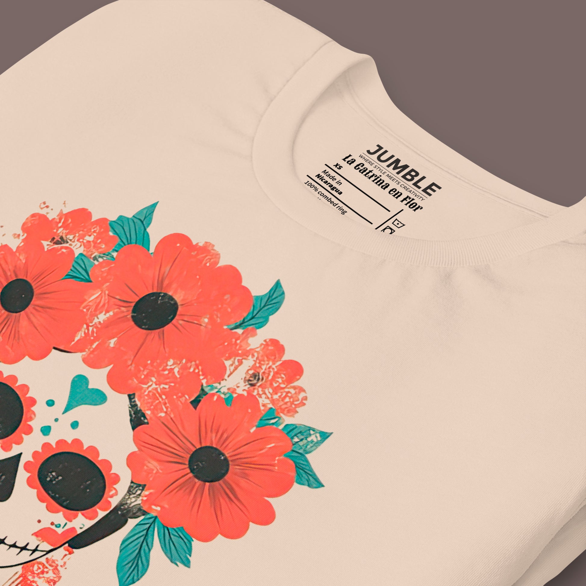 closeup of folded soft cream La Catrina en Flor Unisex t-shirt