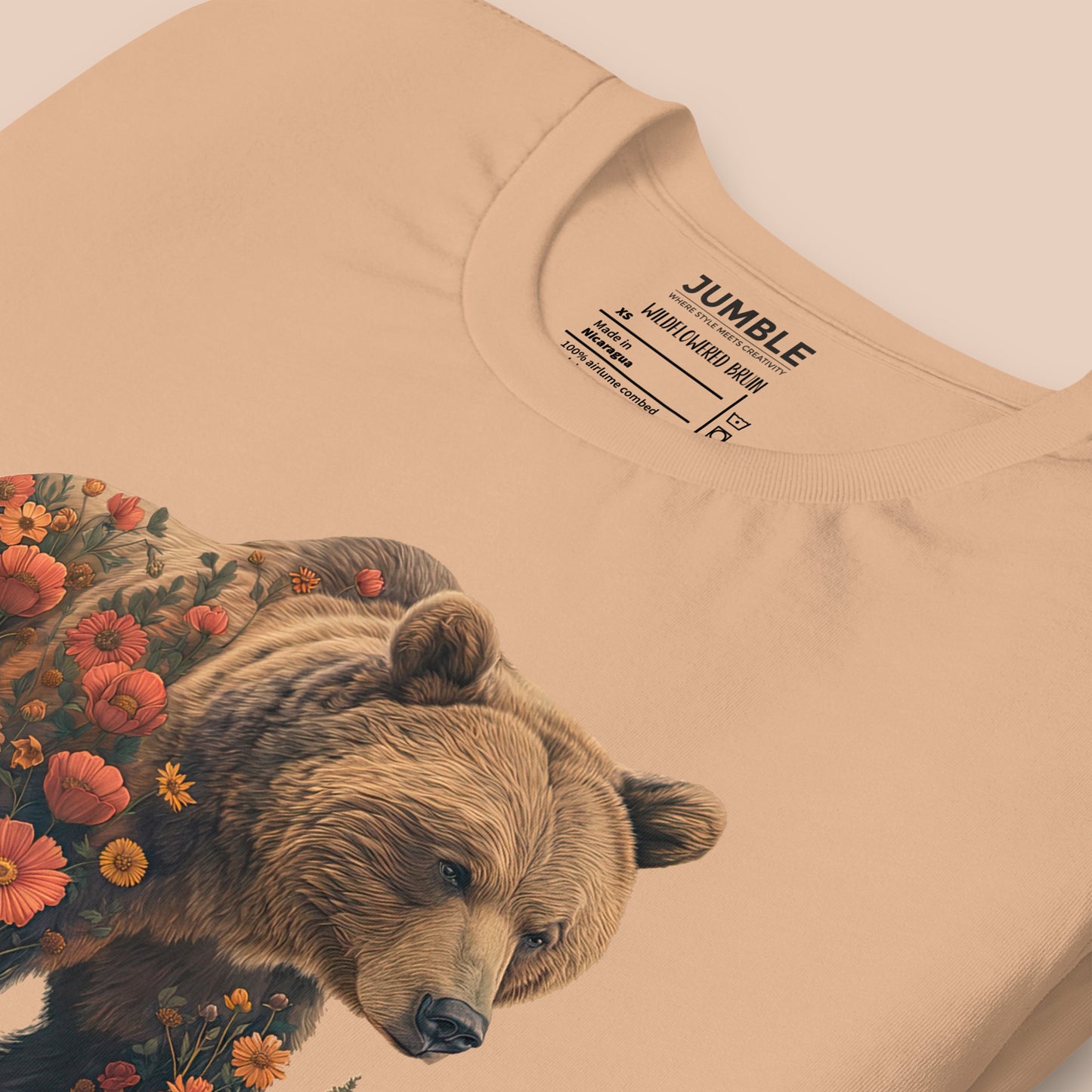 closeup of folded tan Wildflowered Bruin Unisex t-shirt 