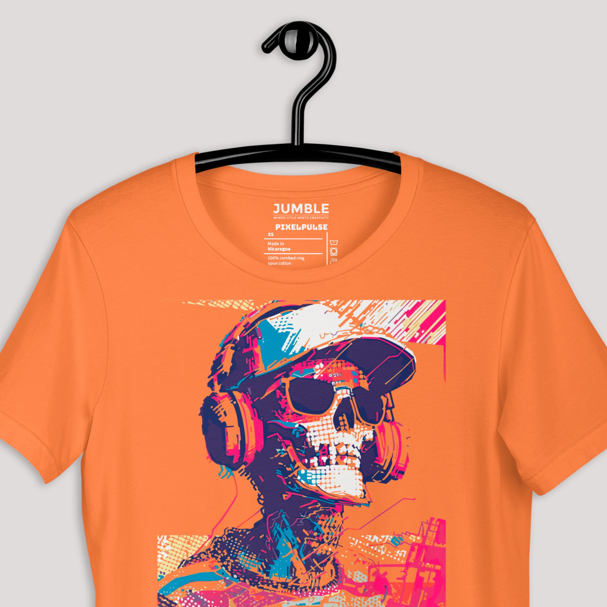 closeup of burnt orange PixelPulse Unisex t-shirt on a hanger