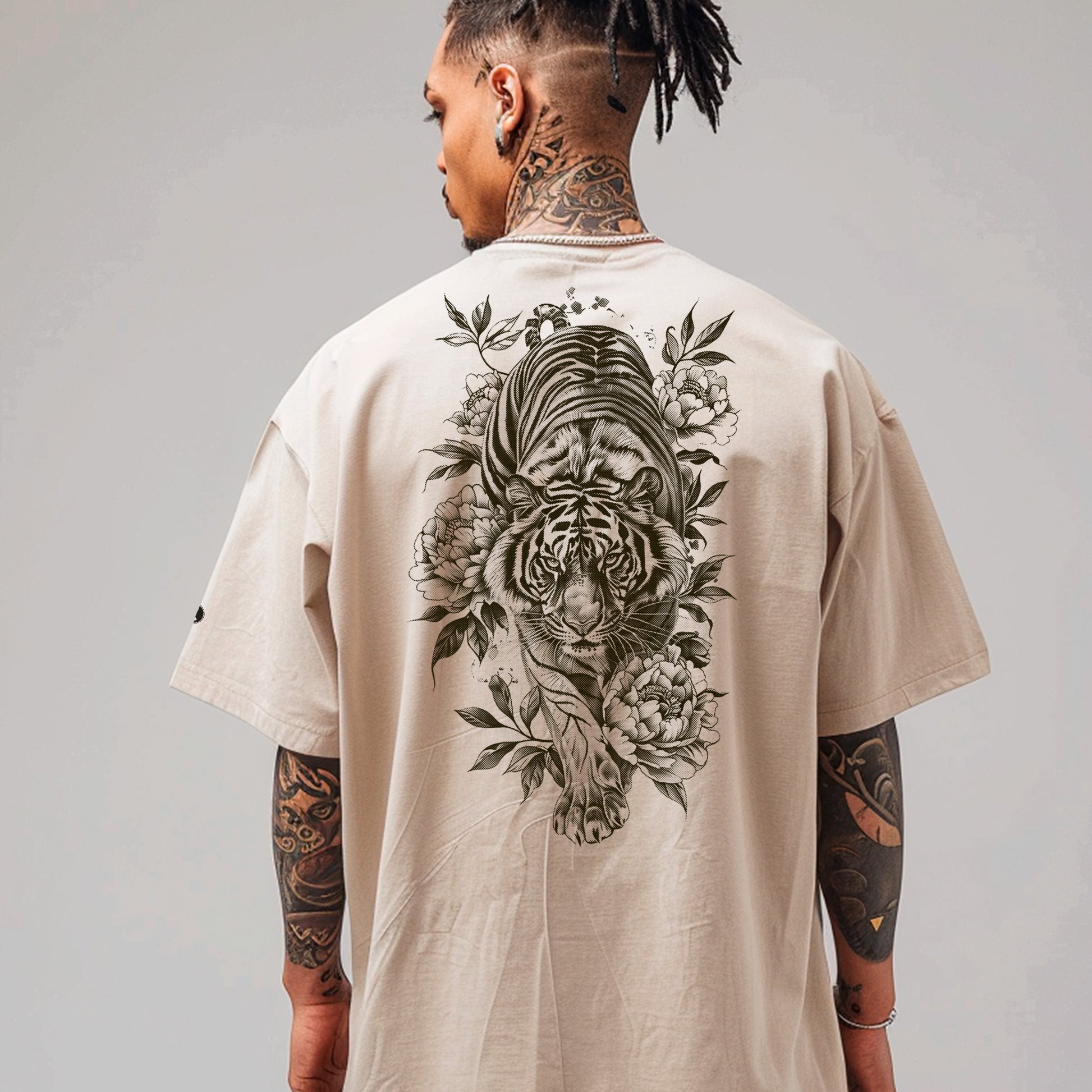 model wearing faded bone Savage Bloom Oversized faded t-shirt (back print)