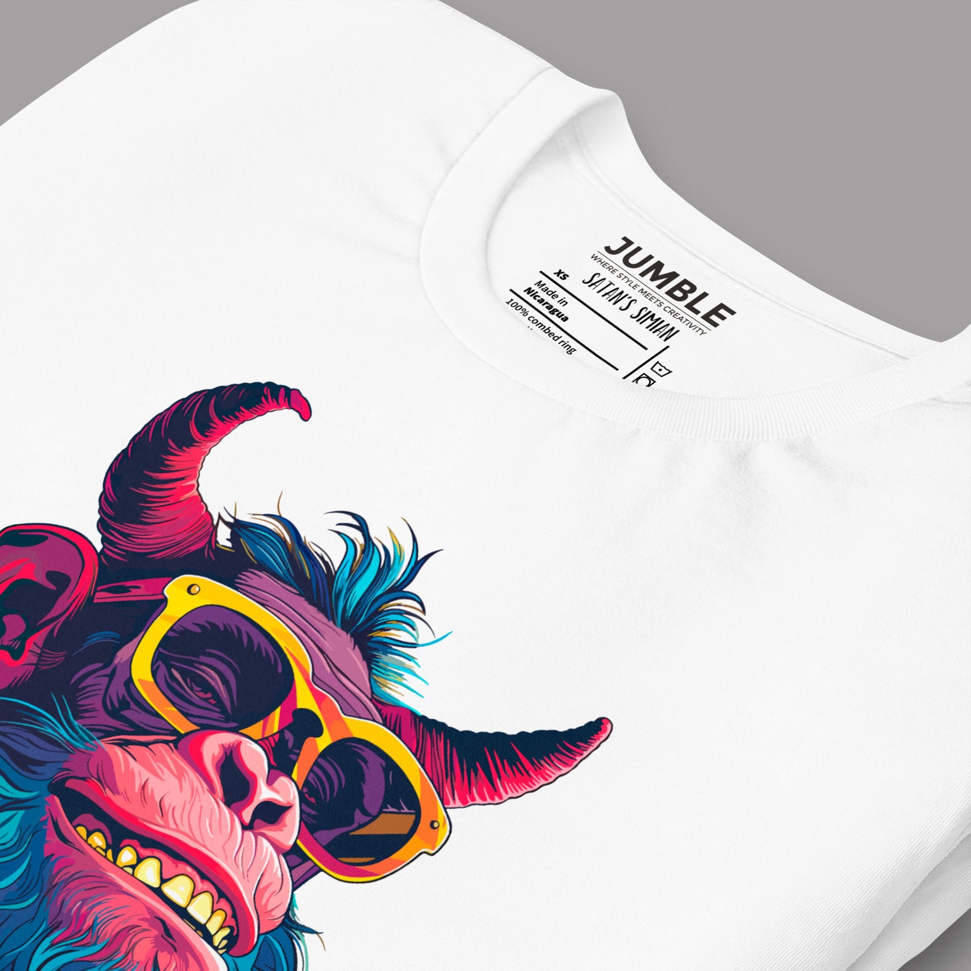 closeup of a white folded Satan's Simian Unisex t-shirt
