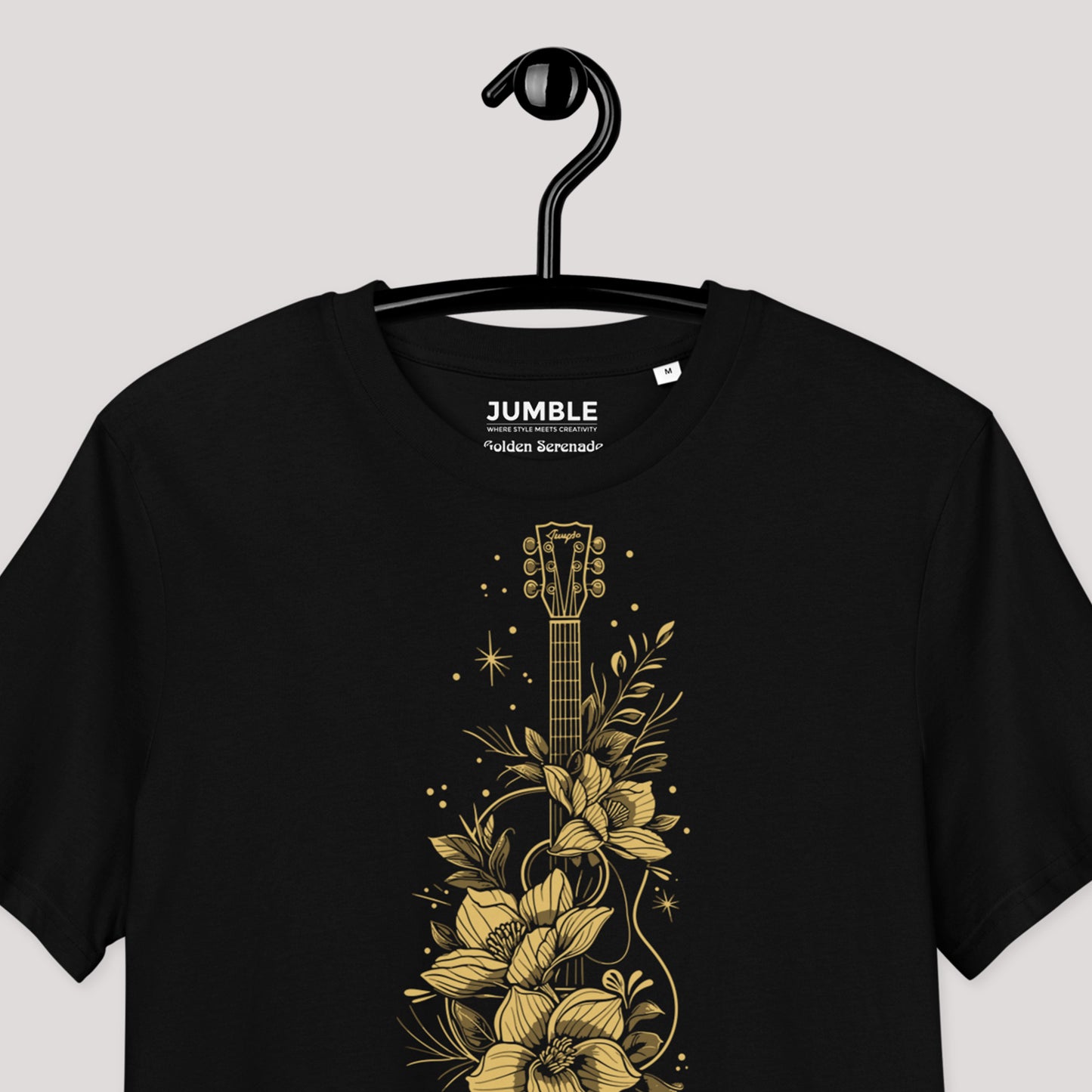 closeup of Golden Serenade Unisex organic cotton t-shirt on a hanger