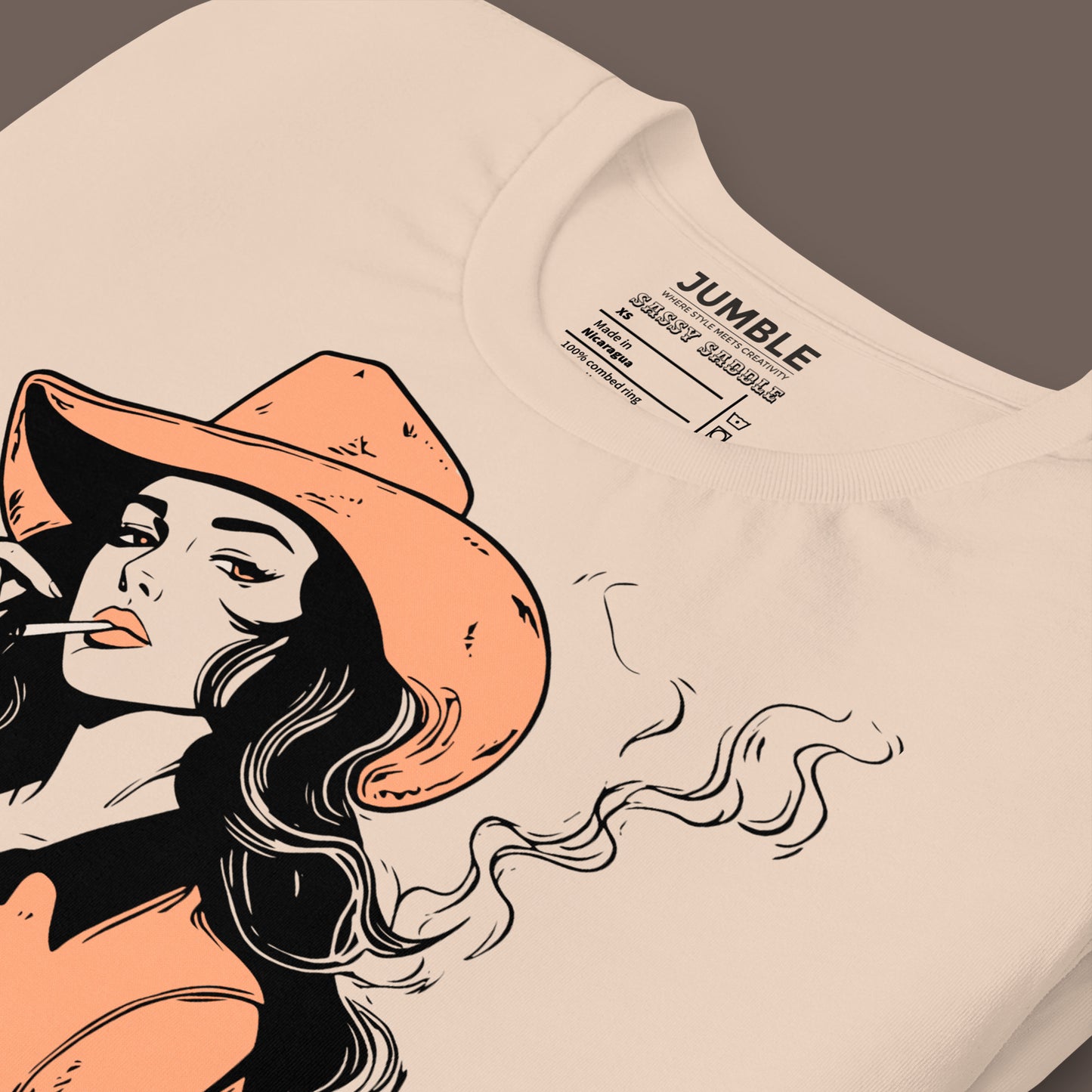 closeup of folded Sassy Saddle Unisex t-shirt