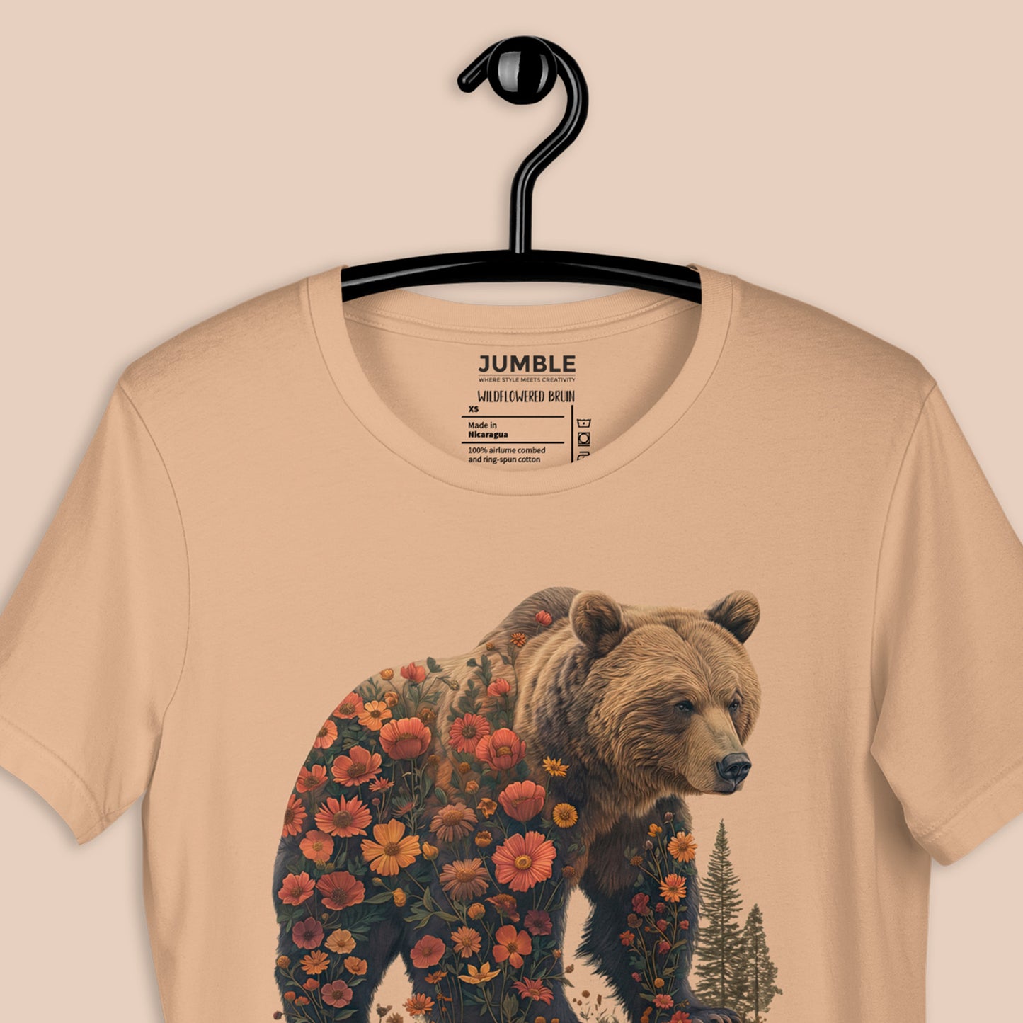 closeup of tan Wildflowered Bruin Unisex t-shirt  on a hanger