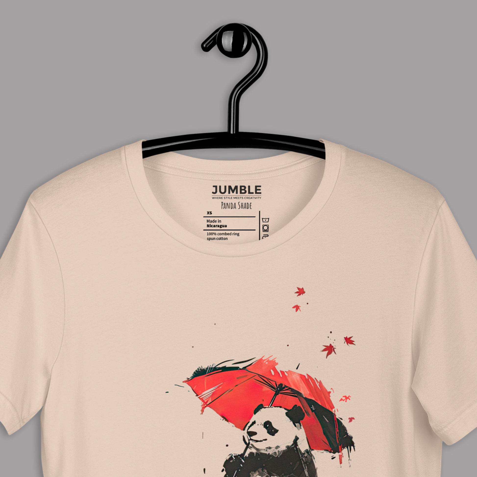 closeup of soft cream Panda Shade Unisex t-shirt  on a hanger