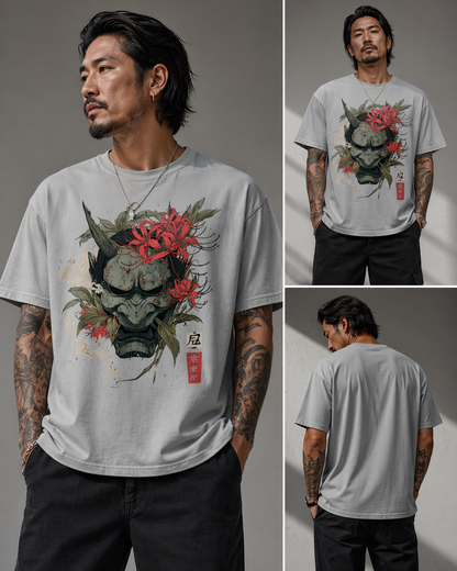 Man wearing a t-shirt with a graphic design of a mask and flowers, shown from front, back, and side views.