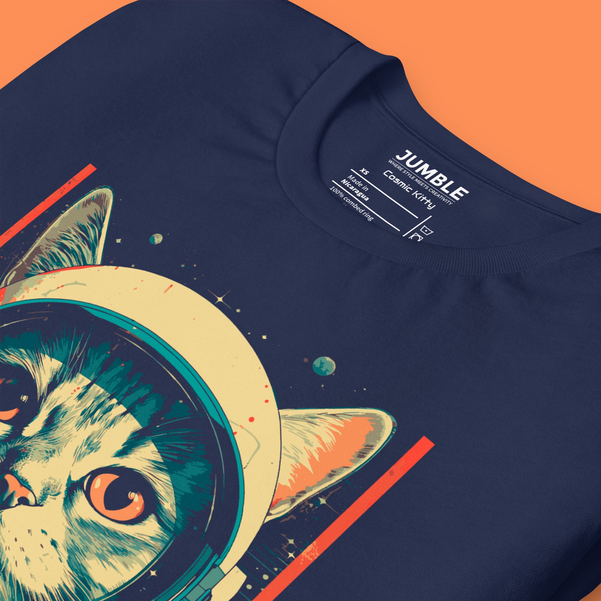 closeup of navy Cosmic Kitty Unisex t-shirt folded