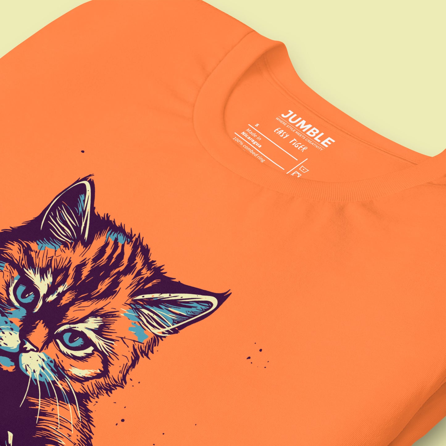 close up of folded burnt orange Easy Tiger Unisex t-shirt