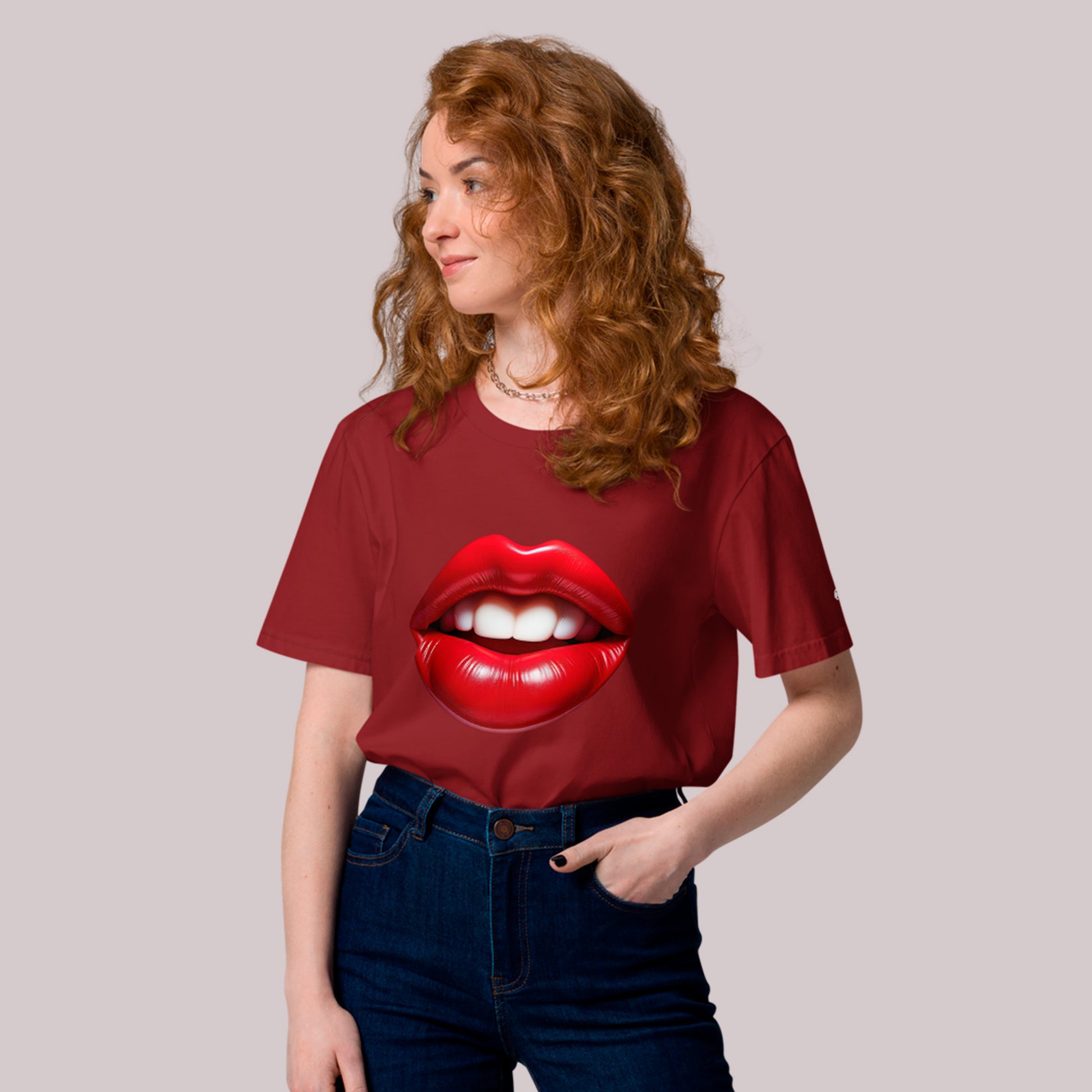 Female model wearing Seductive Vermillion Unisex organic cotton t-shirt, in burgundy.