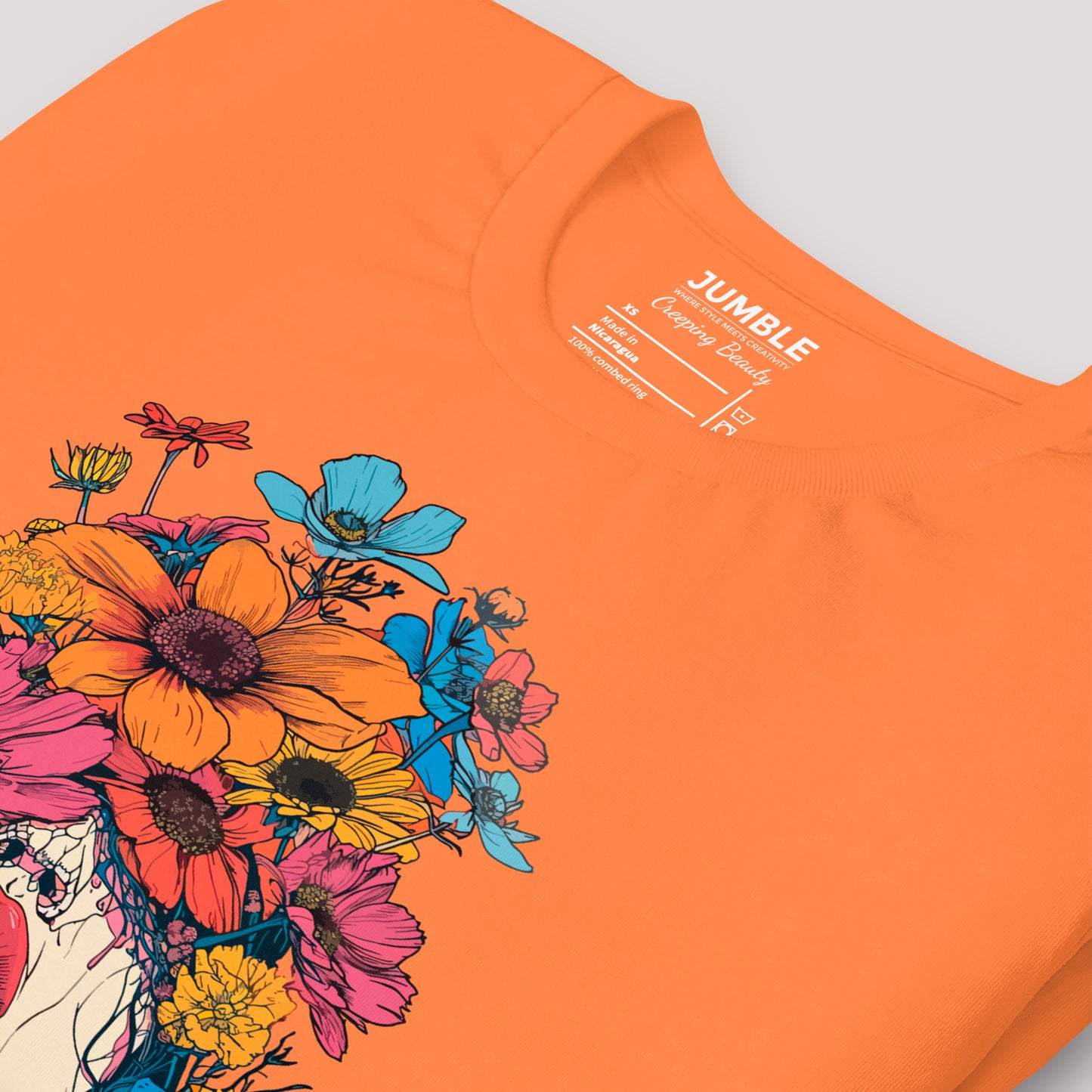 closeup of folded burnt orange Creeping Beauty Unisex t-shirt