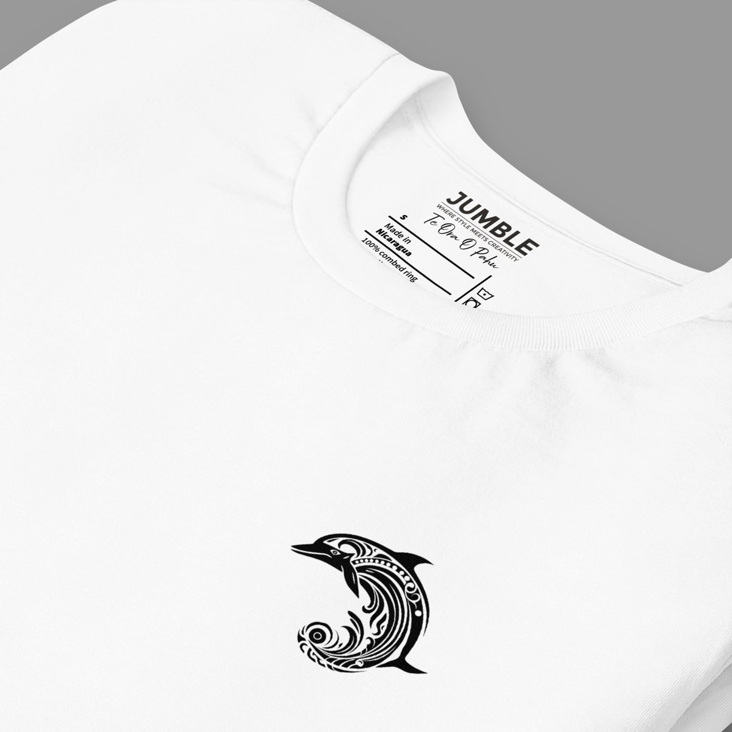 closeup of folded white Te Ora O Pahu Unisex t-shirt
