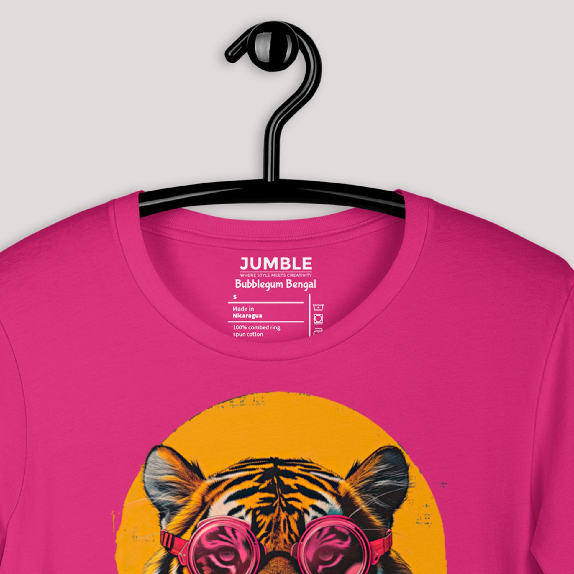 closeup of Bubblegum Bengal Unisex t-shirt on a hanger