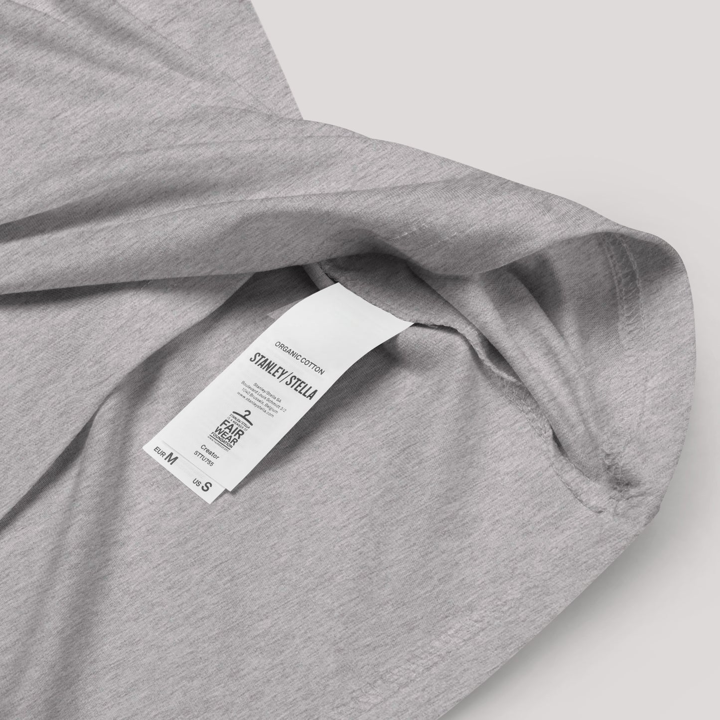 Close-up of Organic Cotton Label on Heather Grey T-Shirt