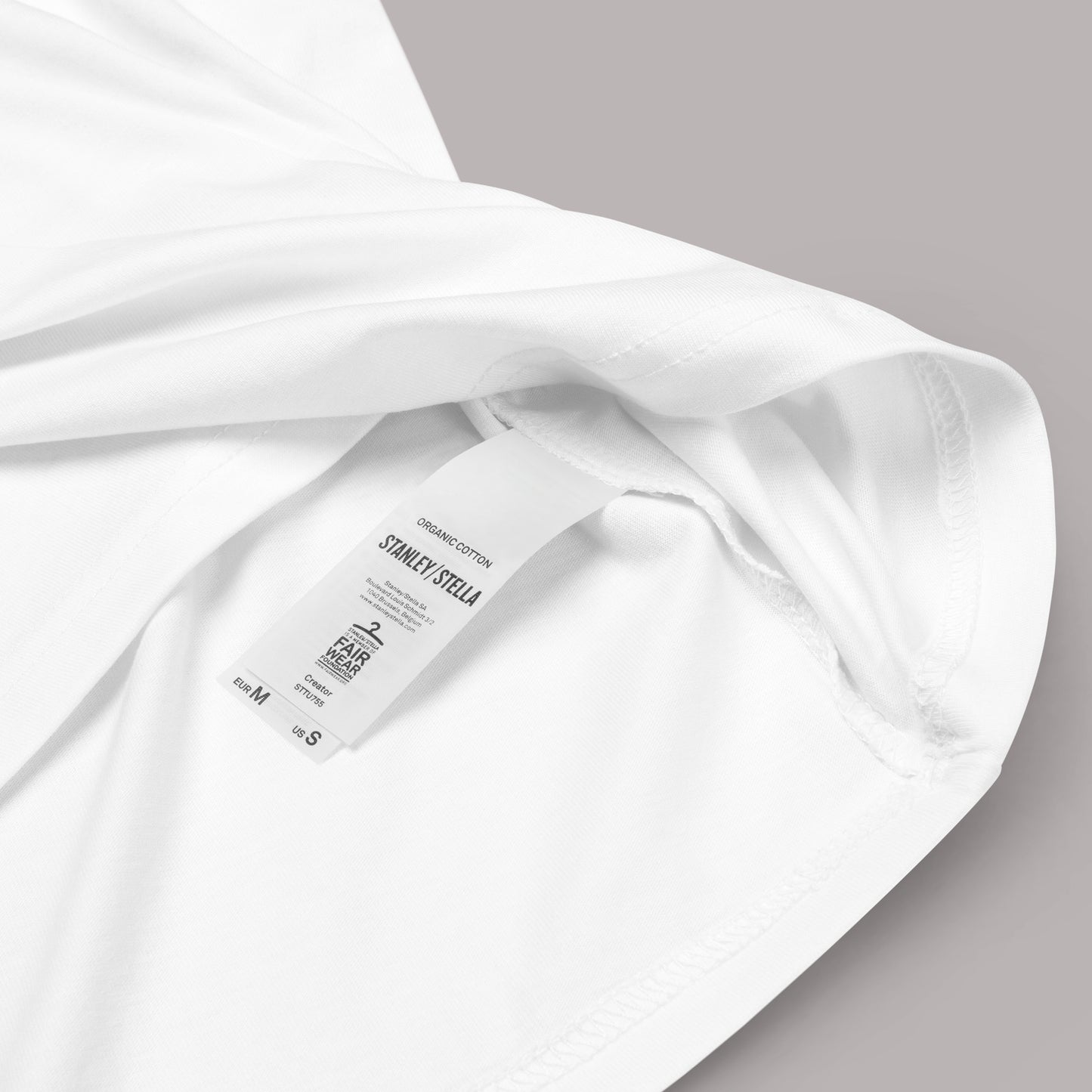 closeup of organic cotton label on Dawn of Change Unisex organic cotton t-shirt