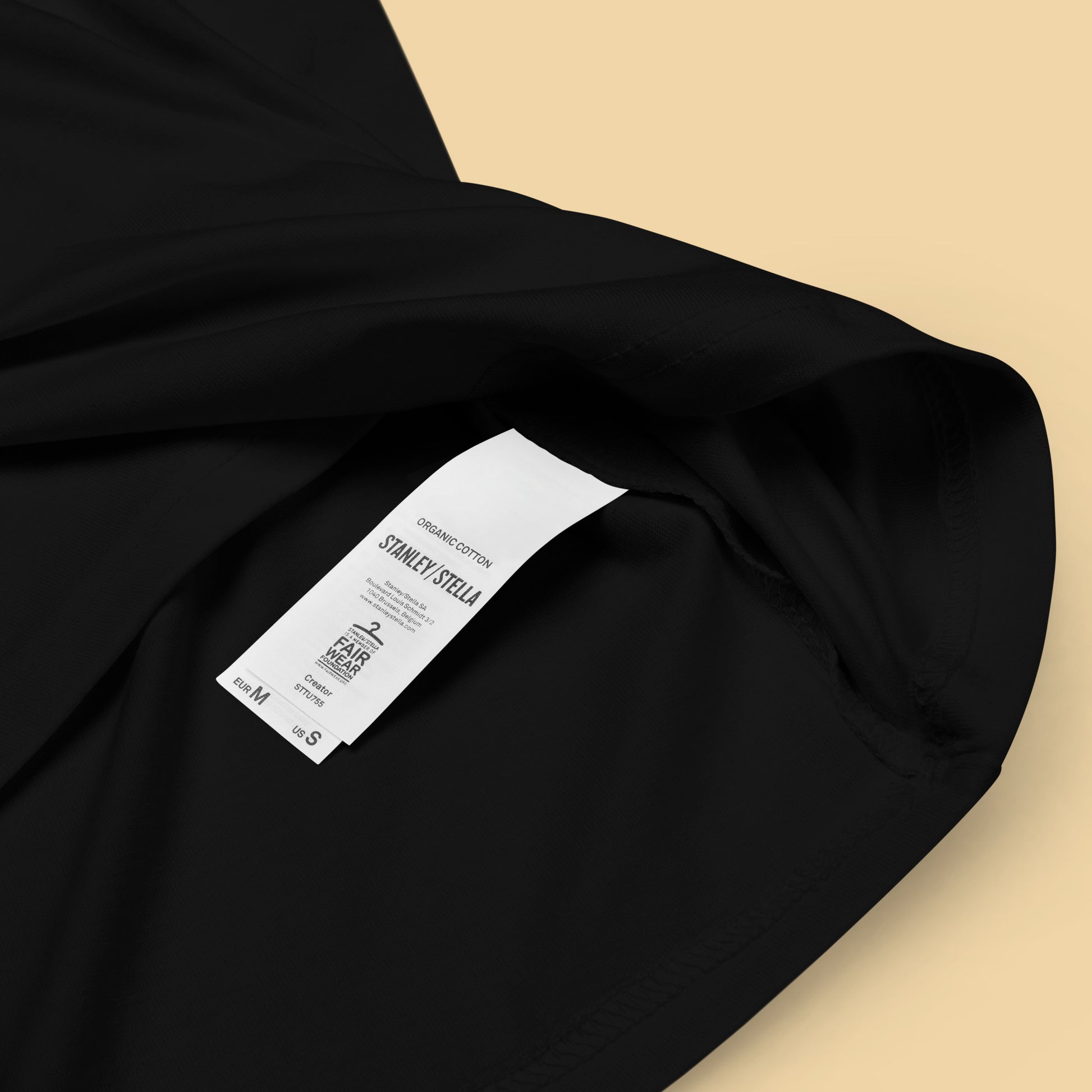 closeup of organic cotton label on a black Luna Glow Unisex organic cotton t-shirt