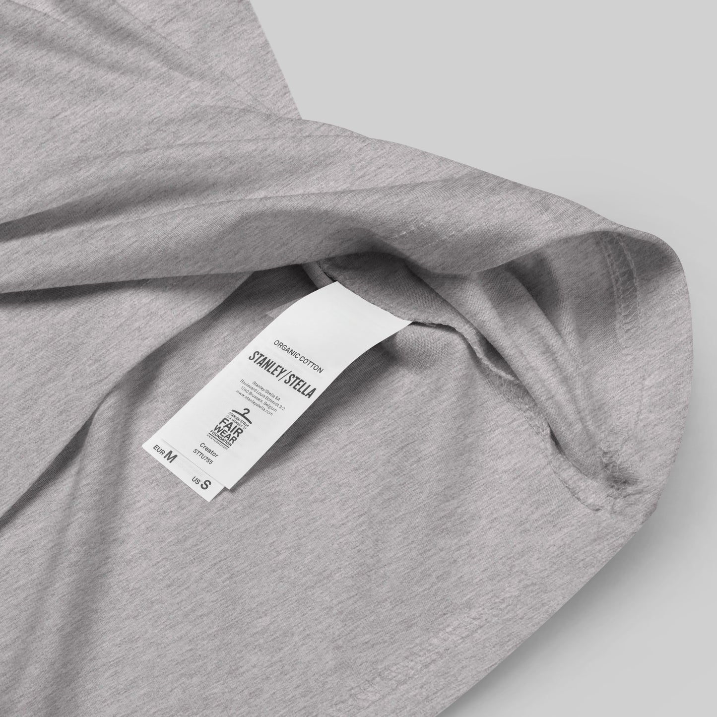 closeup of organic cotton label on a heather grey Ivory Guard Unisex organic cotton t-shirt