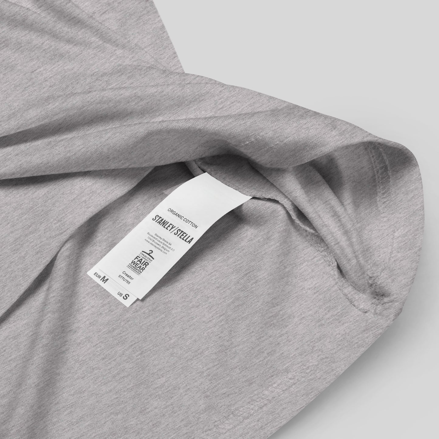 closeup of organic cotton label on heather grey The War on Wants Unisex organic cotton t-shirt