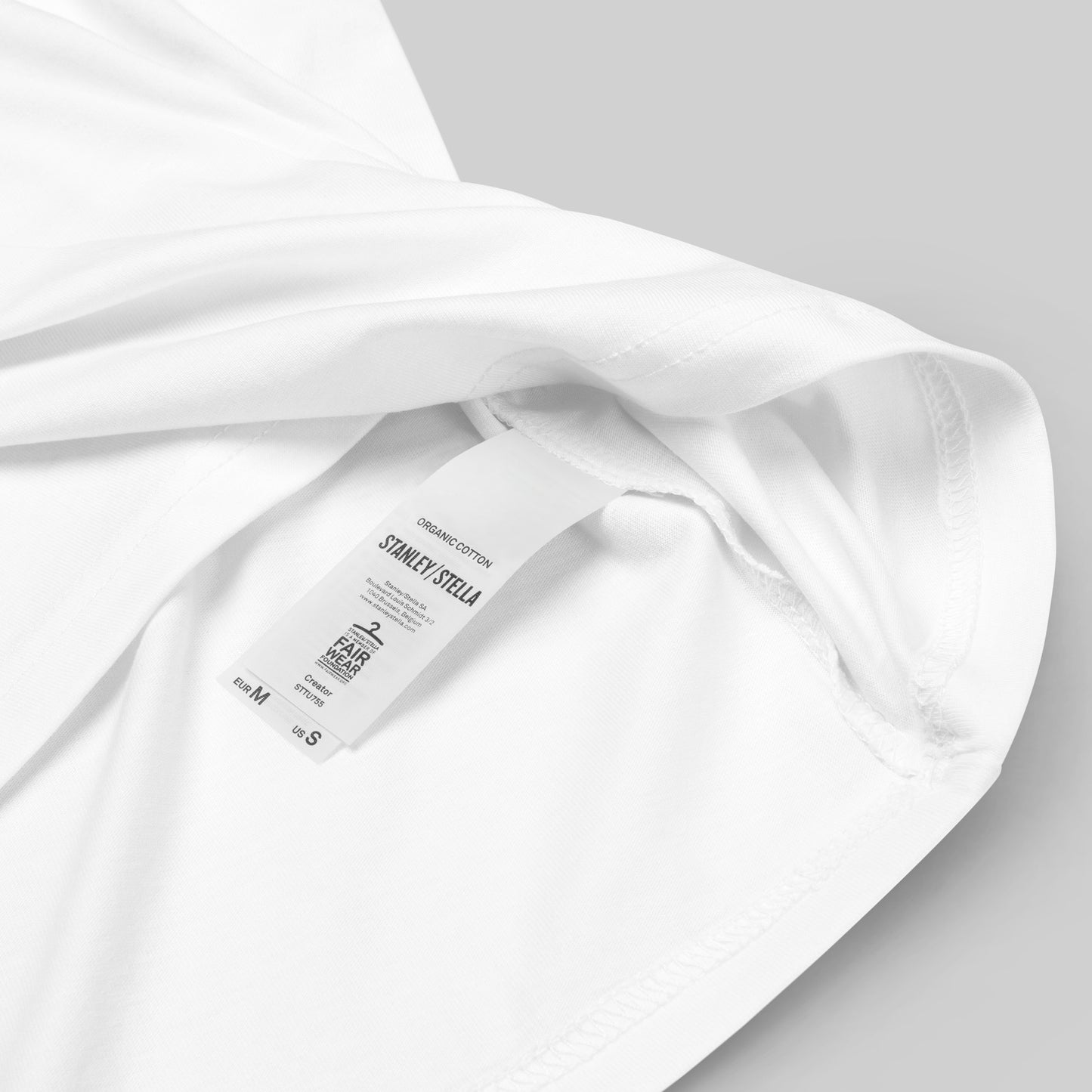 closeup of organic cotton label on white Ivory Guard Unisex organic cotton t-shirt