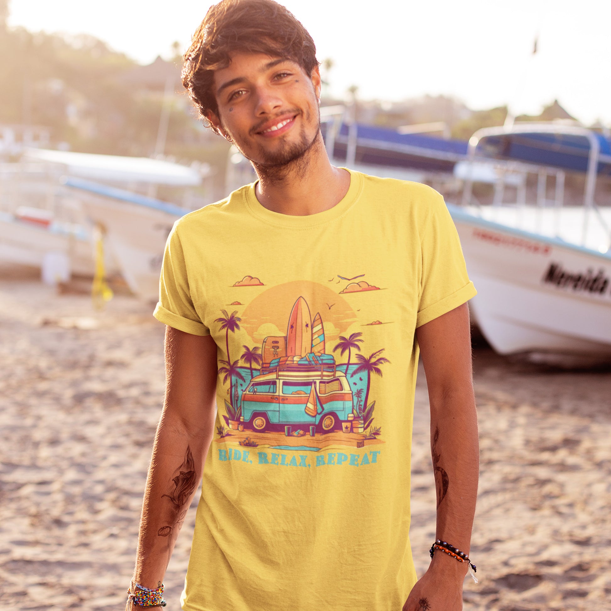 Male model wearing Unisex "Ride, Relax, Repeat" T-Shirt in Yellow on a beach.