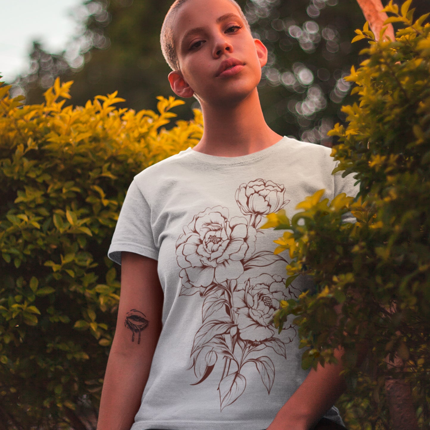 female model wearing Inked Bouquet Unisex organic cotton t-shirt