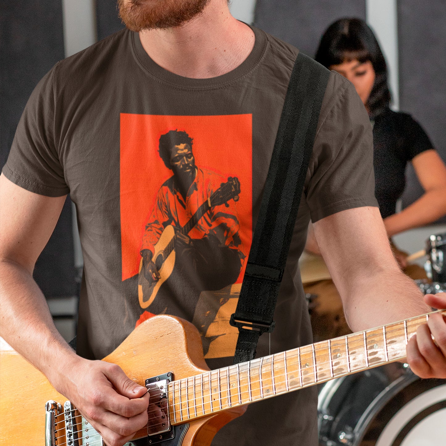 model playing guitar and wearing Crimson Blues Unisex t-shirt