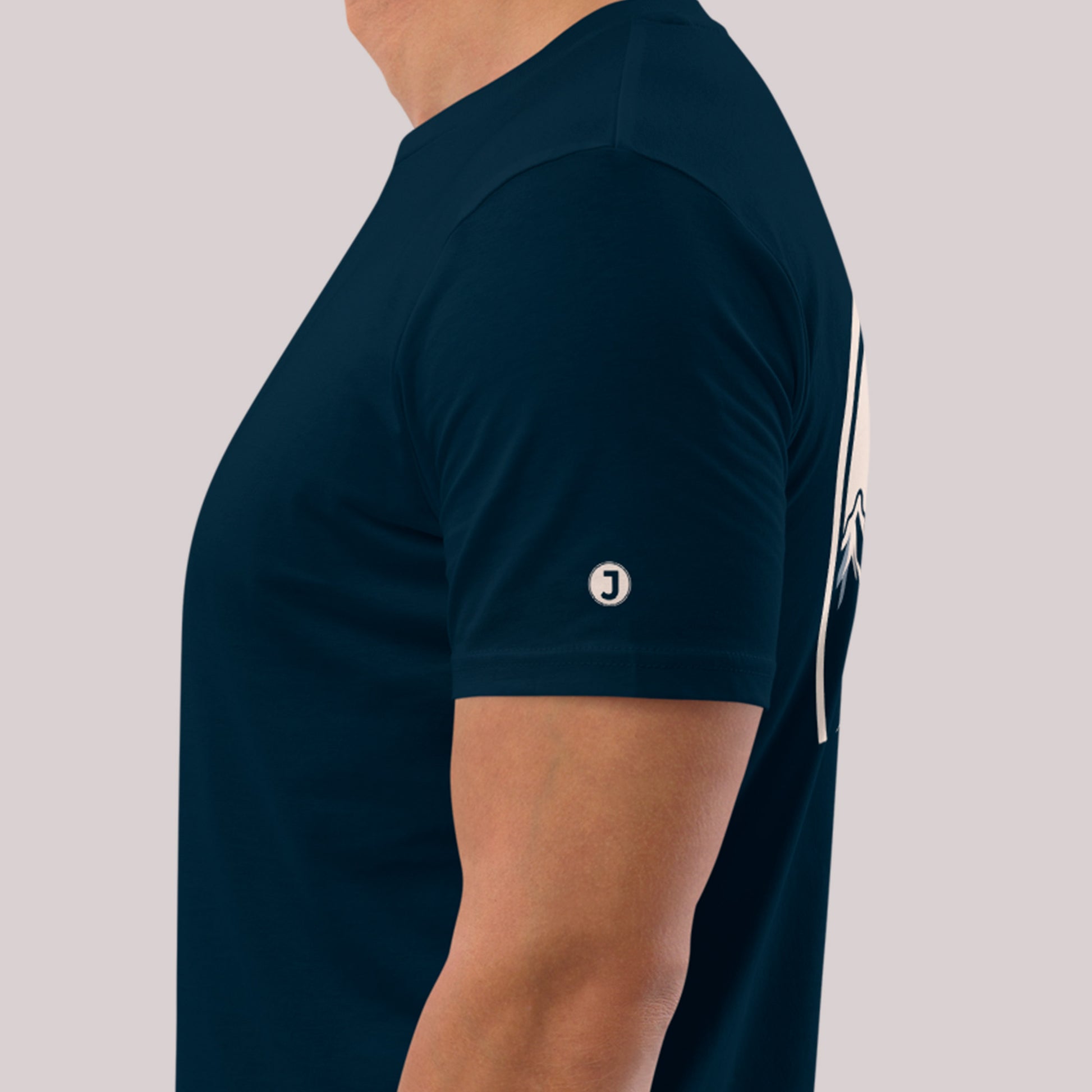 closeup of left sleeve logo on Falcon Peak Unisex organic cotton t-shirt