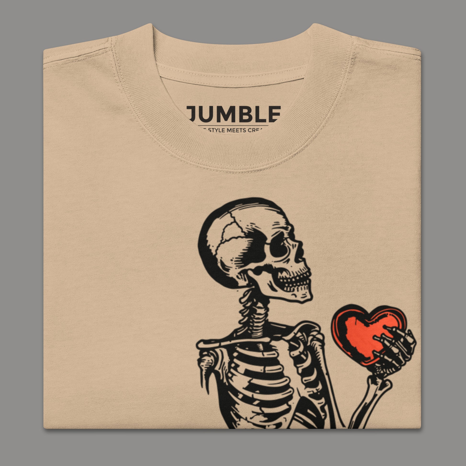 folded closeup of khaki Heart of Bone Oversized faded t-shirt