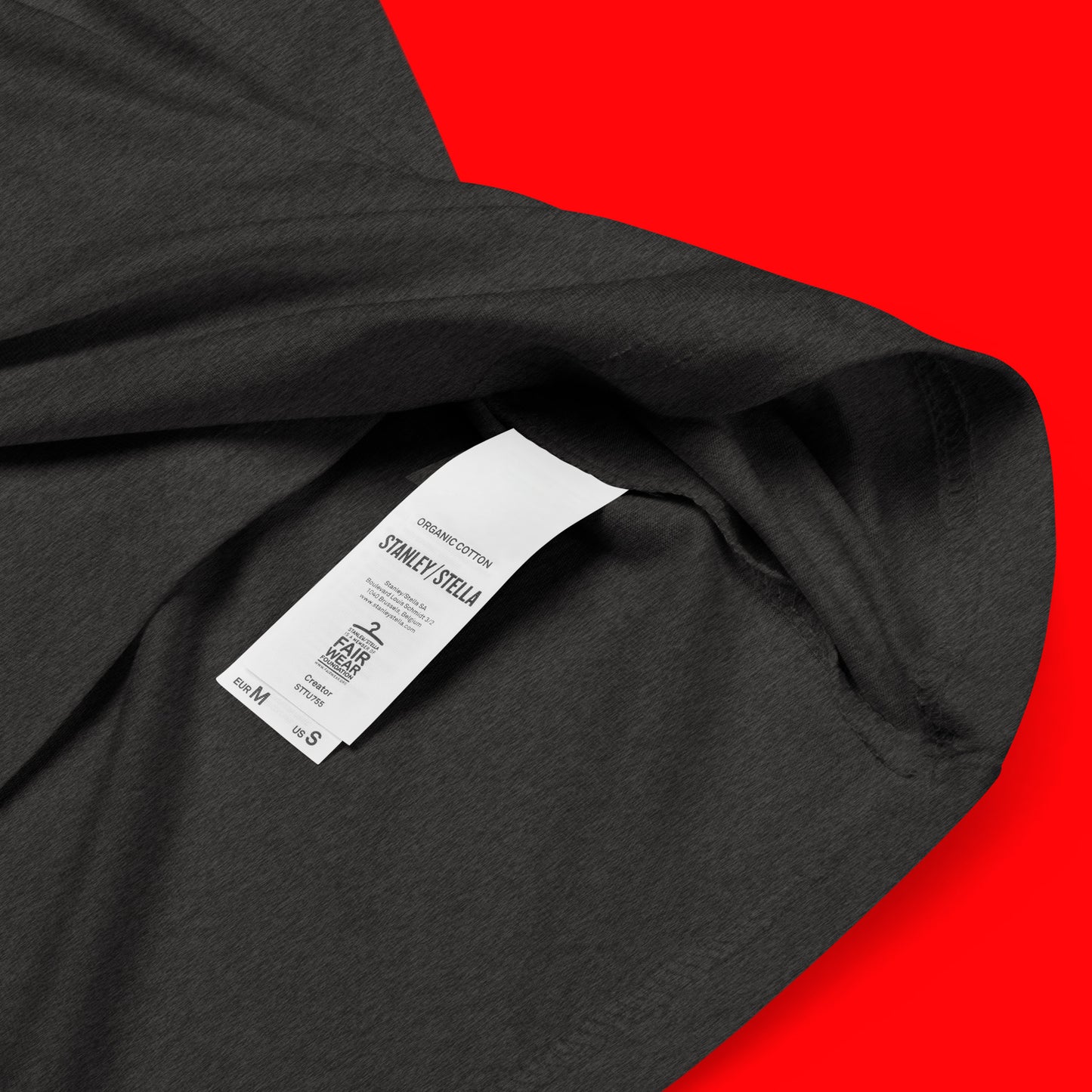 close up of organic cotton label on female model wearing Facets of Femininity Unisex organic cotton t-shirt- in dark heather grey
