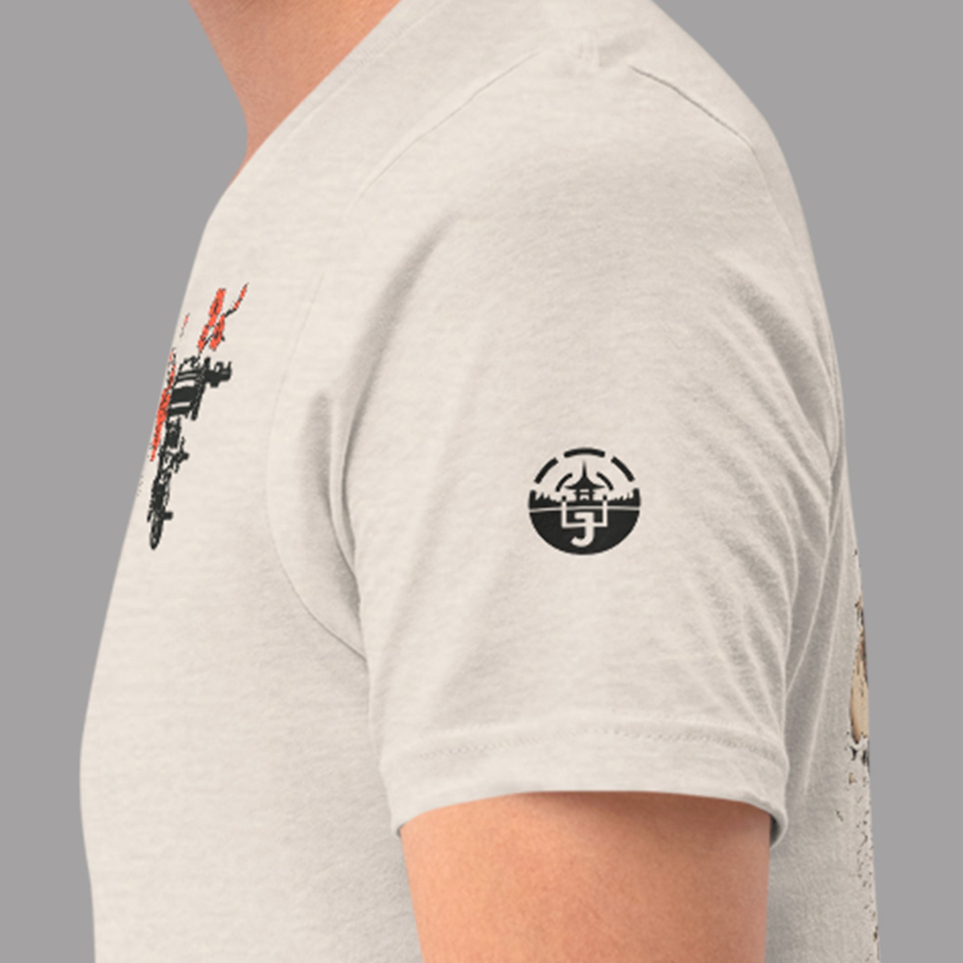 closeup of sleeve logo on heather dust Shogun Unisex t-shirt