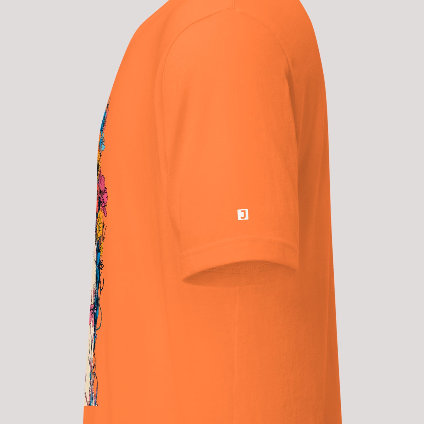 left sleeve logo on burnt orange Creeping Beauty Unisex t-shirt