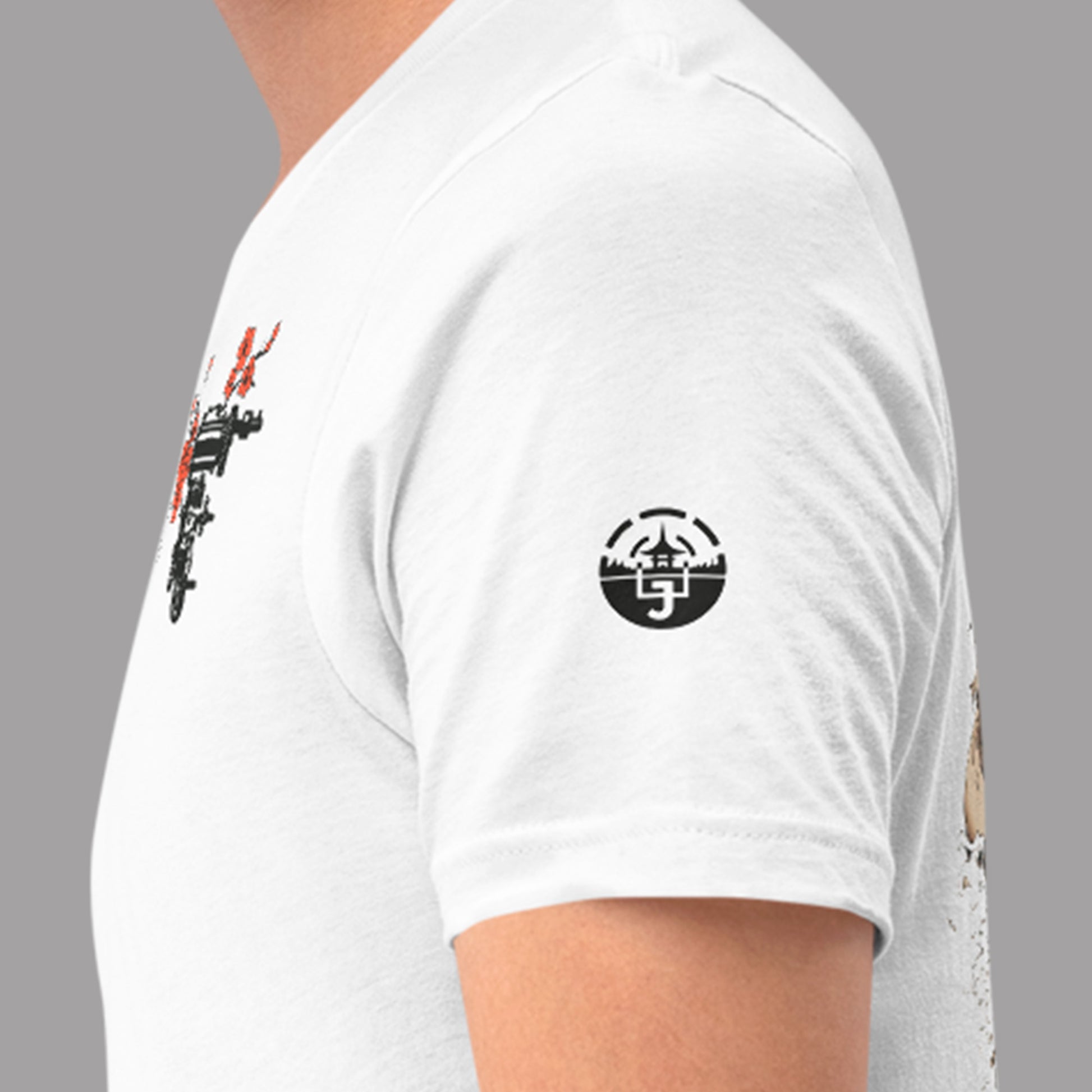 closeup of sleeve logo on white Shogun Unisex t-shirt