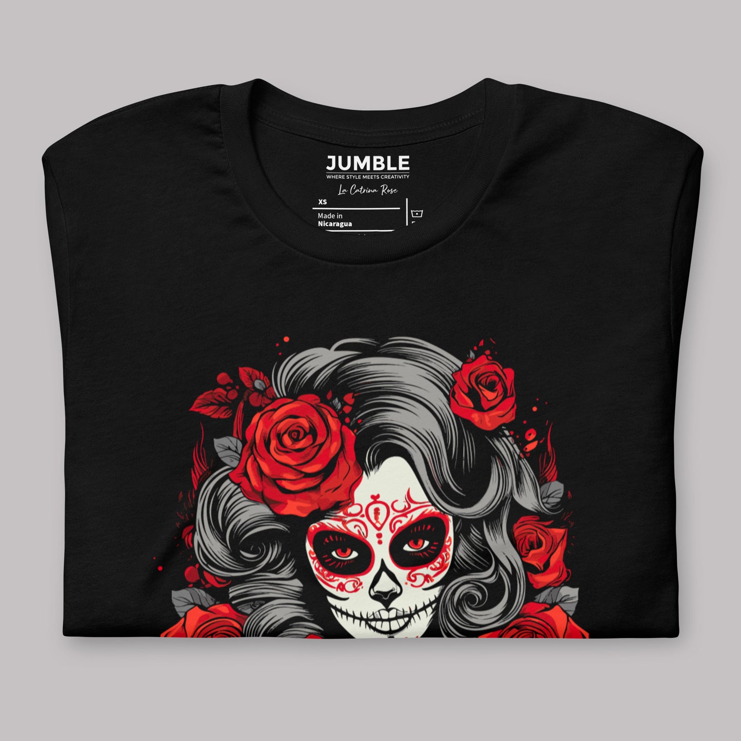 closeup of black La Catrina Rose Unisex t-shirt, folded