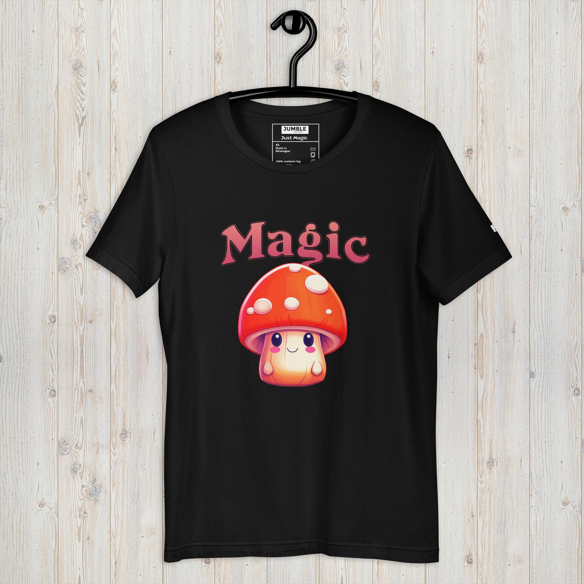 black Just Magic Unisex t-shirt displayed on a hanger