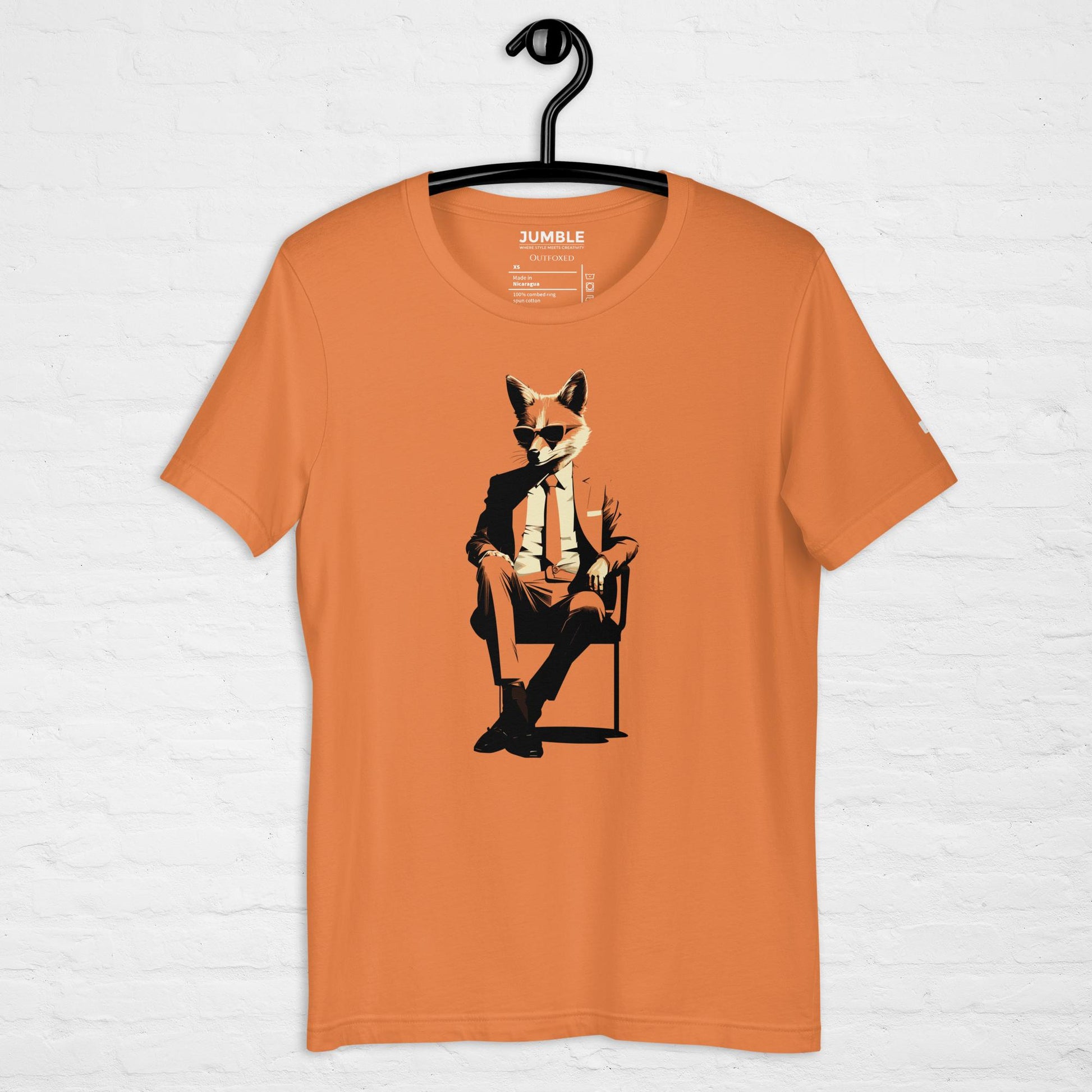 burnt orange Outfoxed  Unisex t-shirt on a hanger