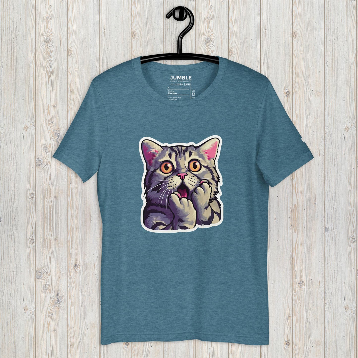 heather deep teal Cat-astrophic Surprise Unisex t-shirt displayed on a hanger